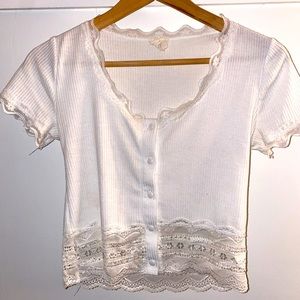 Caution to the wind white cropped top. Lace button up.